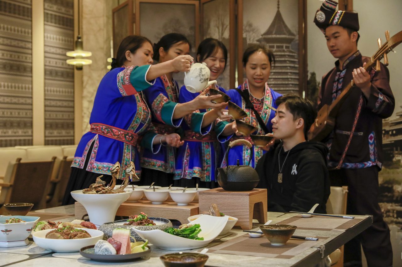 A group of people in traditional clothingAI-generated content may be incorrect.